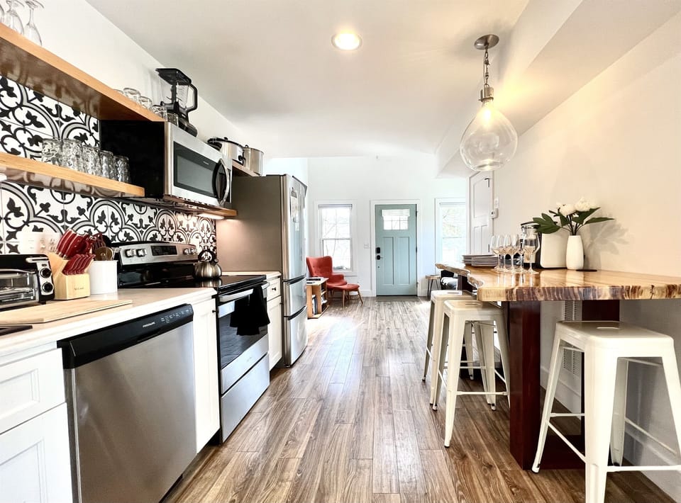 Open floor plan with Farmhouse American-minimalist design