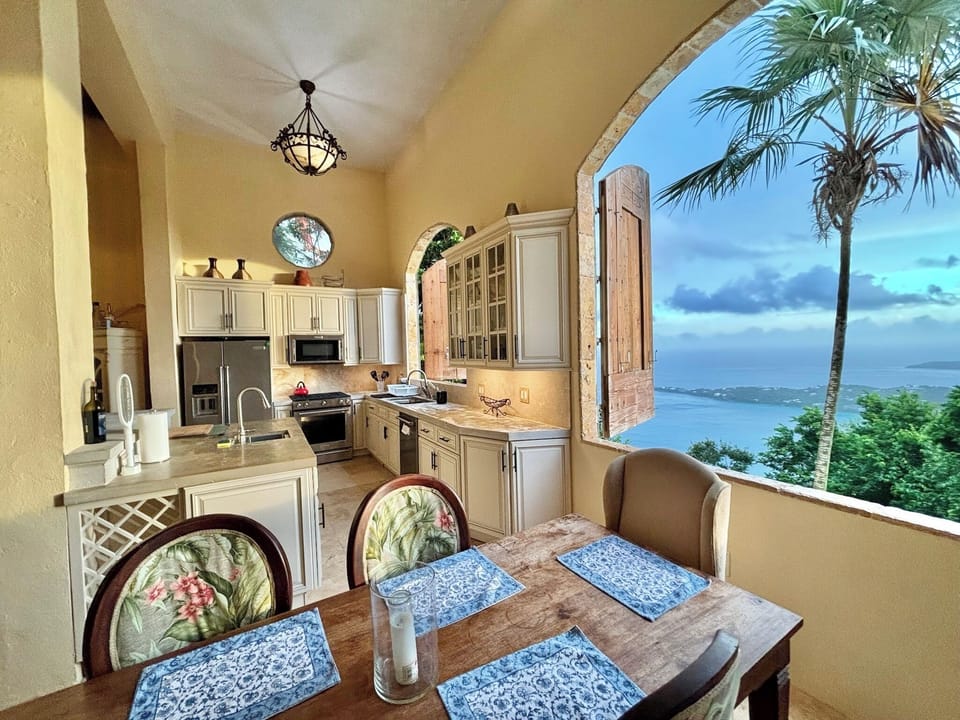 Dining and Kitchen area , Open to the beautiful tropical environment .