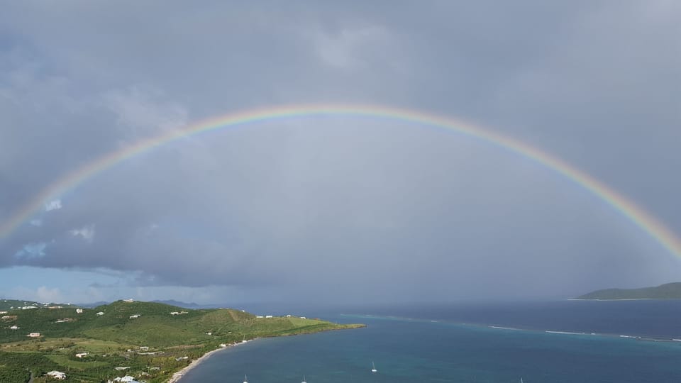 West view of huge rainbow after rain