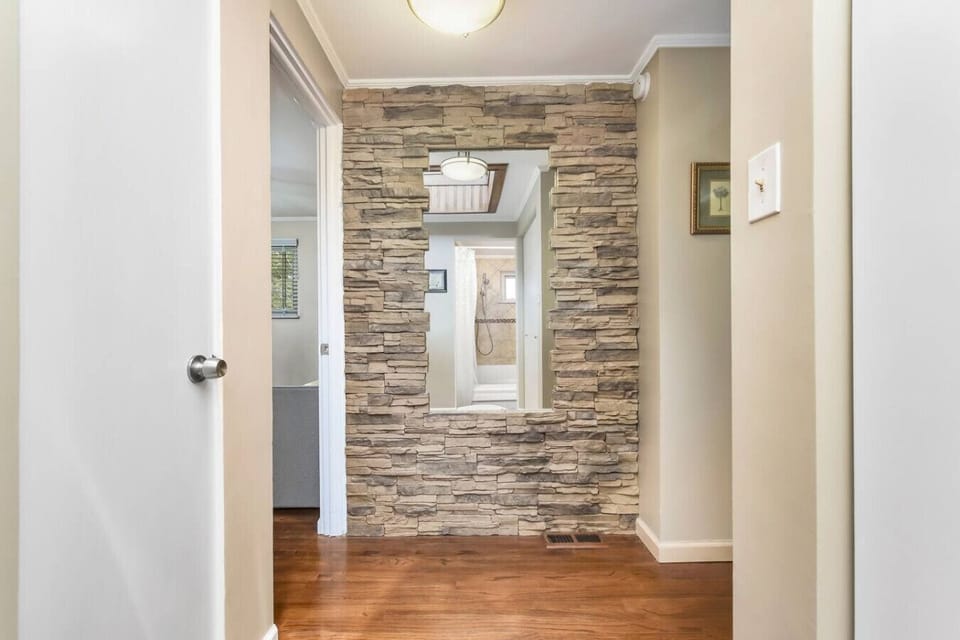 More skylights and stonework bring in nature, even in the hallways.