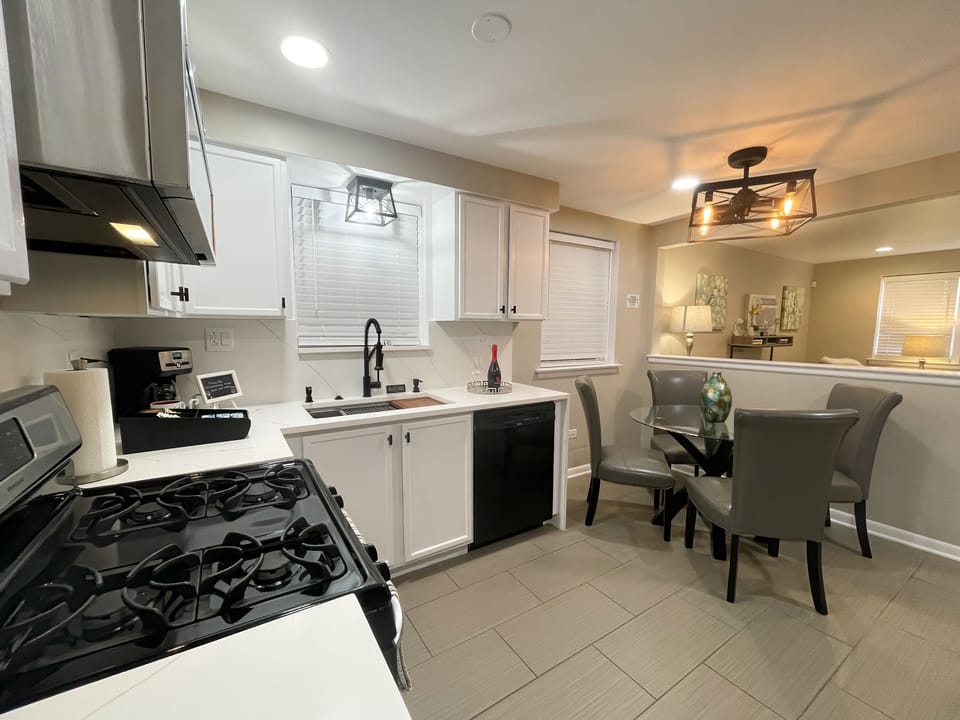 WOW! Amazing fully stocked kitchen with quartz countertop, full backsplash, etc.