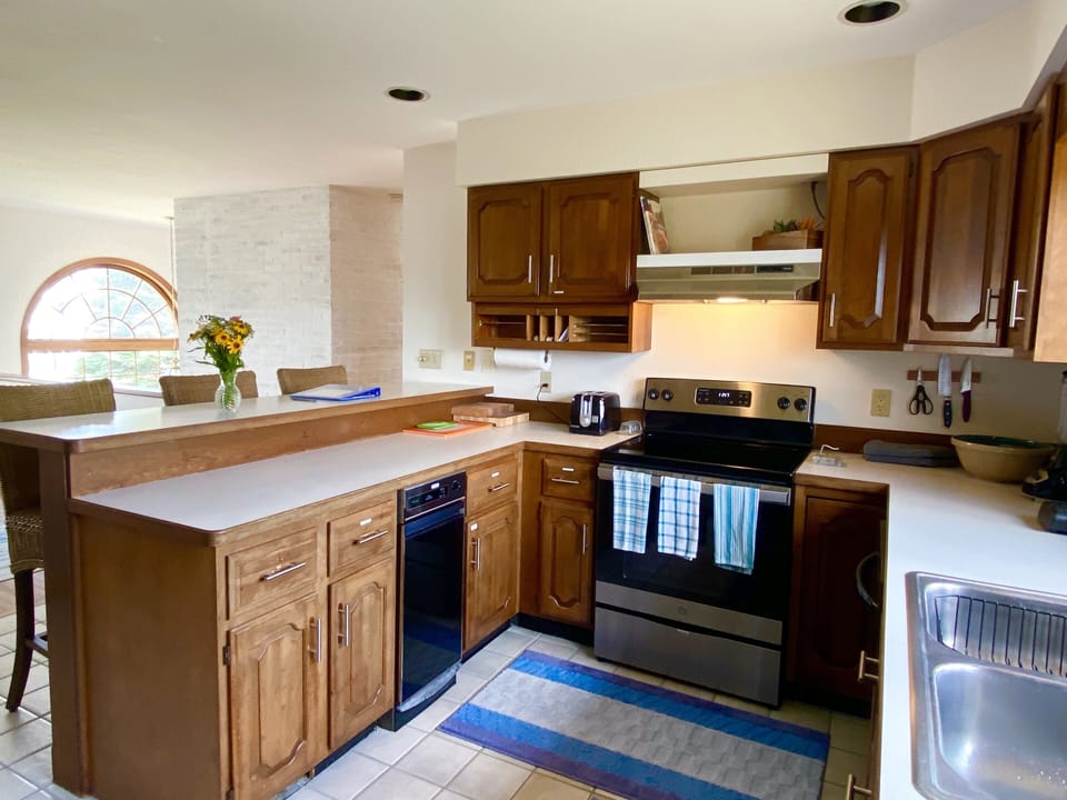2nd floor: Kitchen is open to breakfast bar and dining area. 