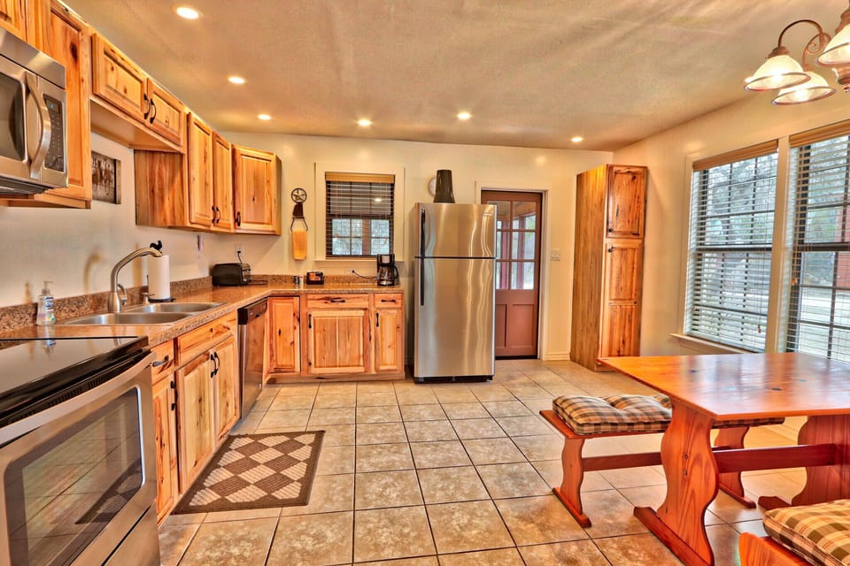 Full kitchen with stove, oven, refrigerator, microwave, and coffee maker