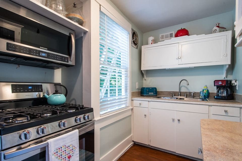 Kitchen with stove and microwave