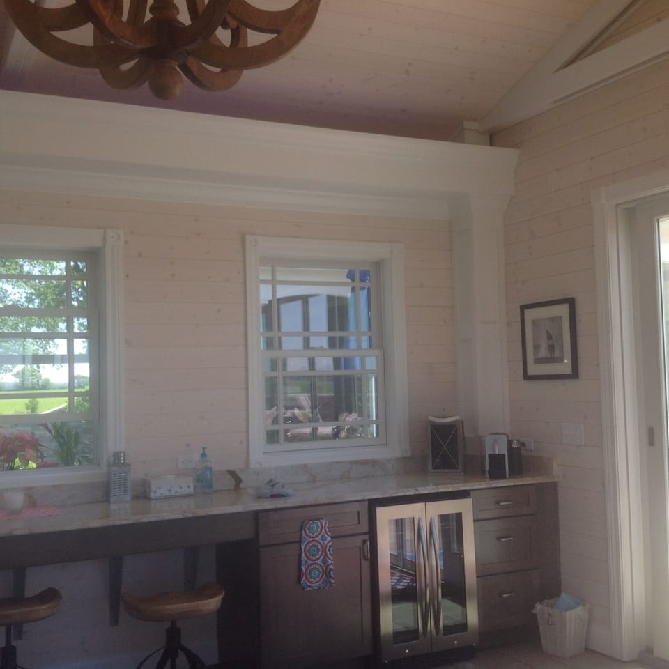 Poolhouse with small frig located behind main house