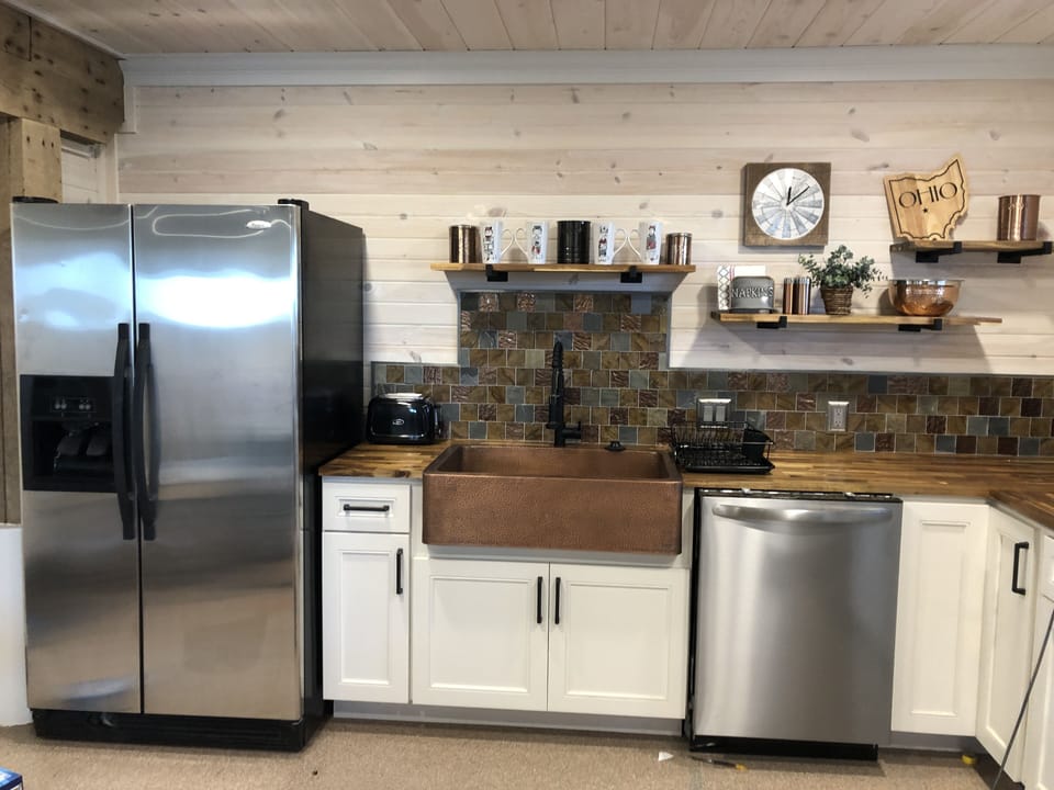 Copper sink, stainless steel appliances 
