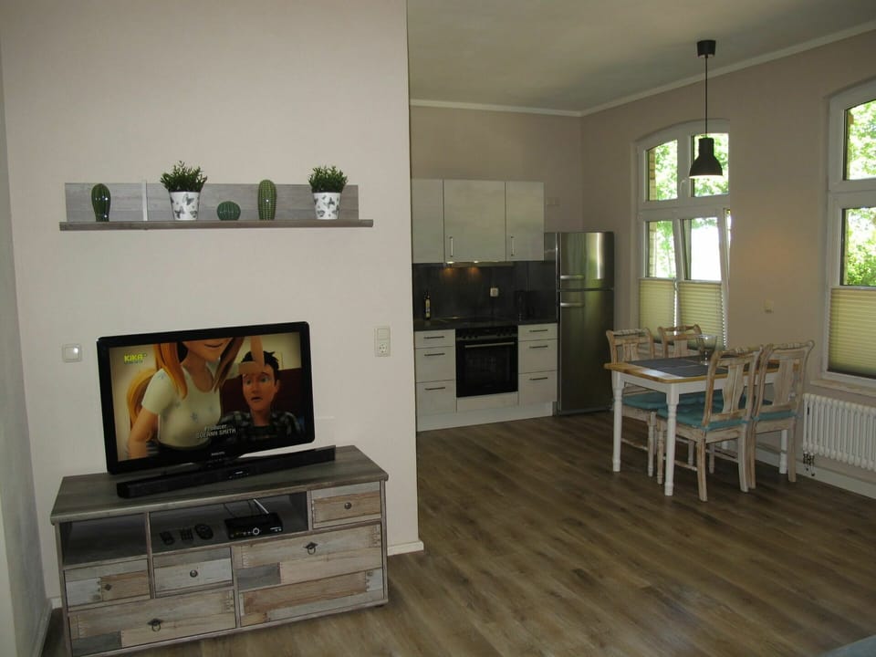 Room, Furniture, Wood Flooring, Living Room, Property, Interior Design, Floor, Laminate Flooring, Hardwood, Hearth