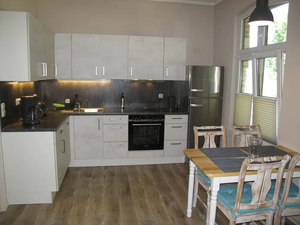 Room, Furniture, Kitchen, Property, Countertop, Cabinetry, Floor, Wood Flooring, Interior Design, Building