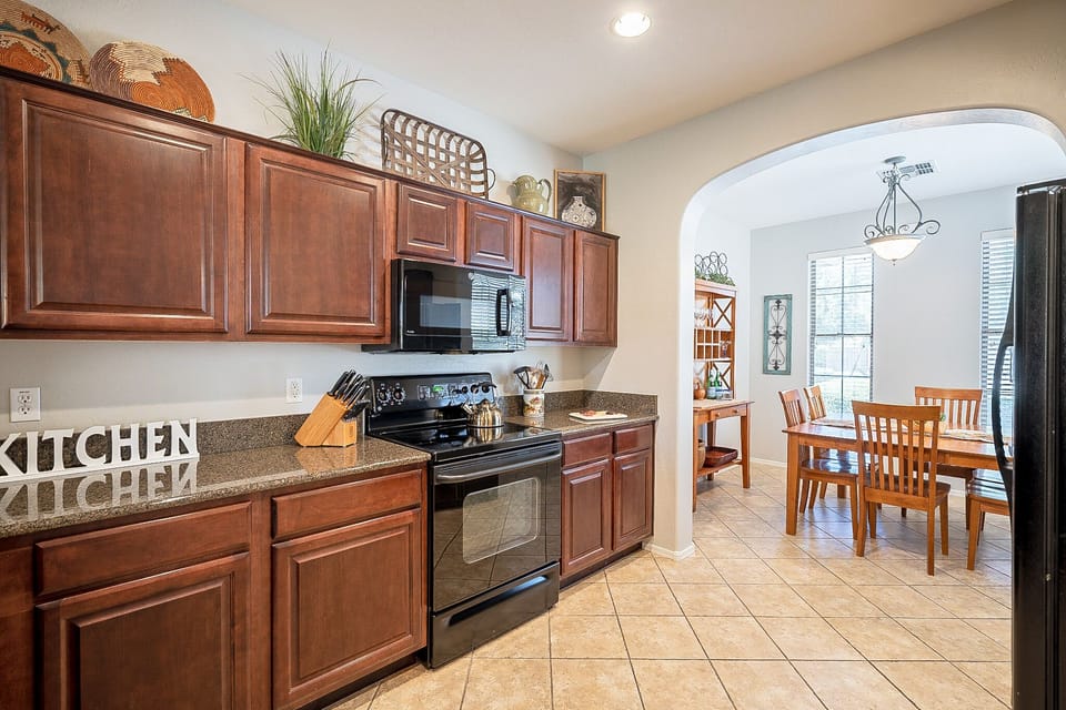 Fully stocked Kitchen with granite countertops.