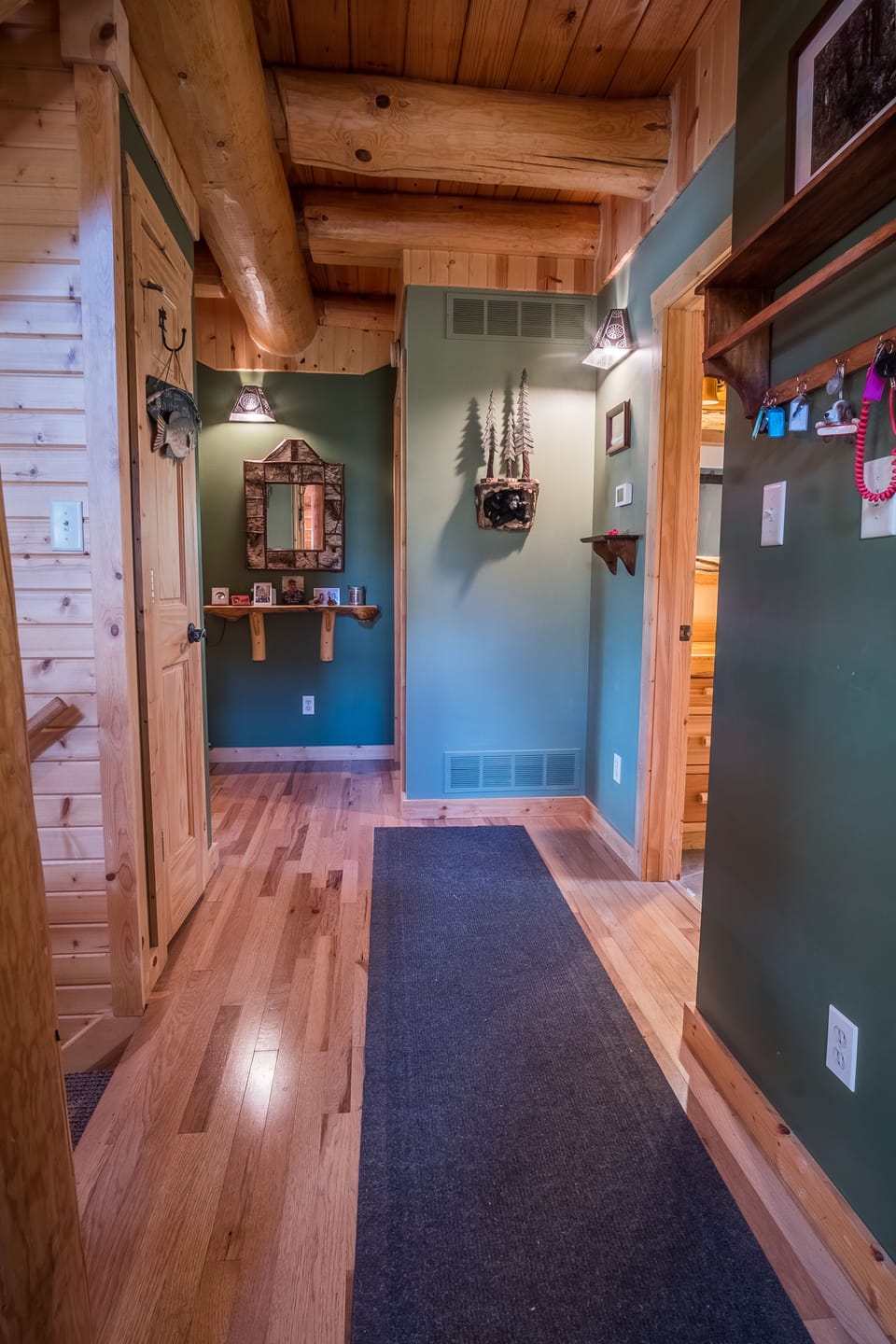 First floor hallway leading to bedrooms & full bathroom.