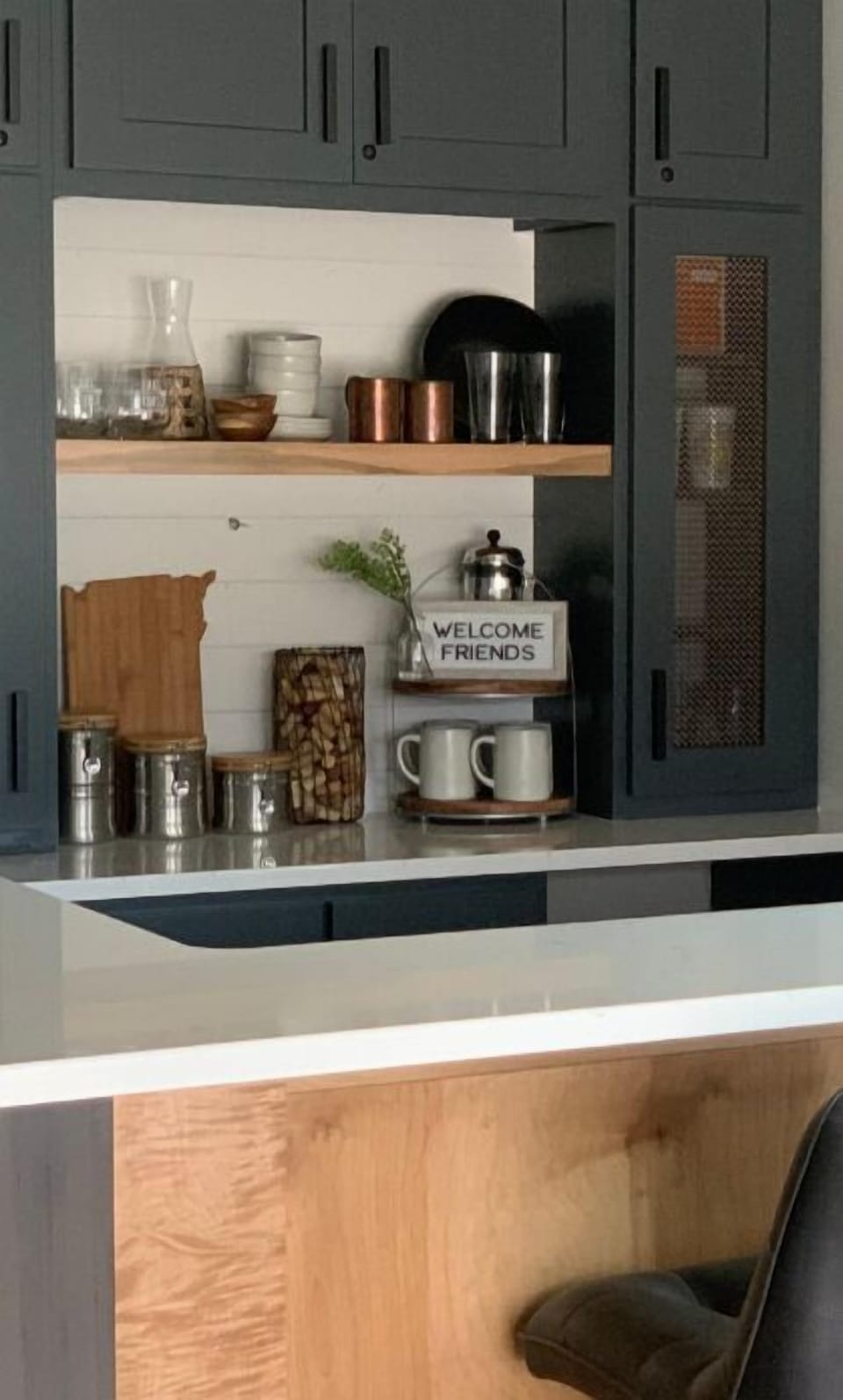 Garage bar/living area stocked w/ barware and undercounter beverage fridge