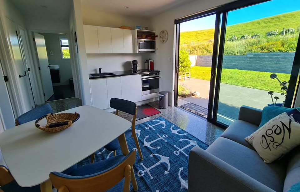 Living area view of kitchen with your own  coffee maker on the bench