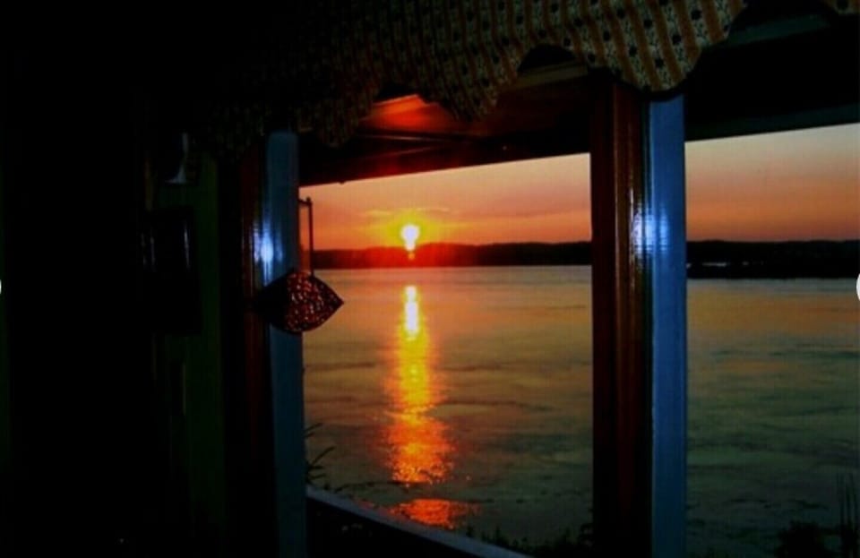 SUNSET FROM THE LIVING ROOM AT THE COTTAGE