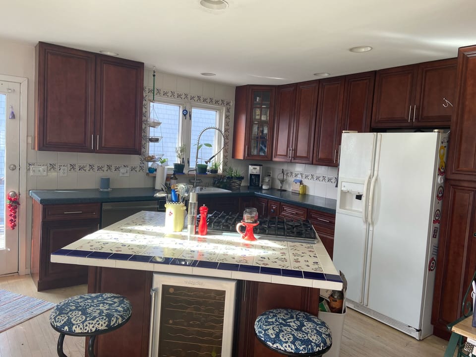 A full kitchen on 2nd floor with a Viking 6 burner cooktop and double wall oven