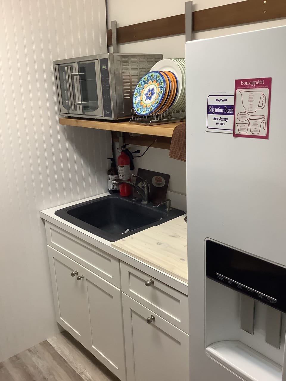 Kitchenette on first floor with full size refrigerator