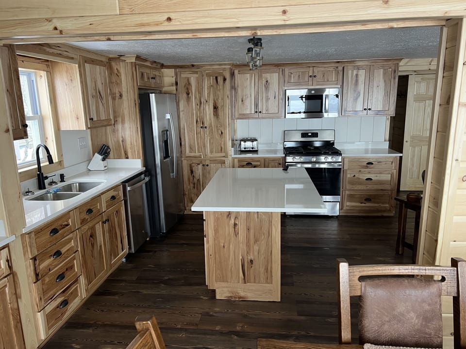 Full kitchen with all new appliances, hickory cabinets, and quartz countertops.