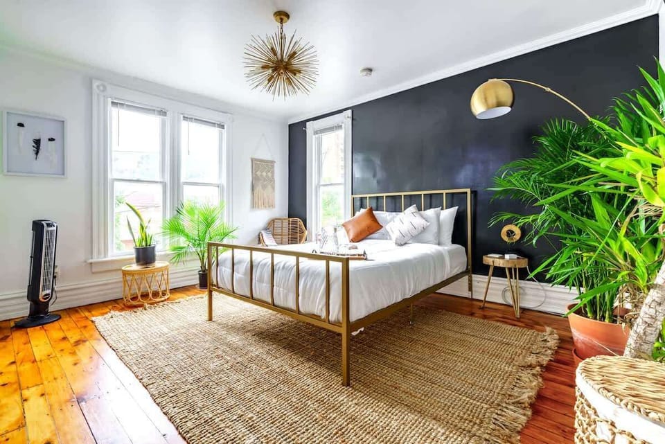 Discover the perfect blend of comfort and style in our bedroom oasis, featuring a plush Queen size bed in the master bedroom!, additional pillows, and the refreshing ambiance of indoor plant! 