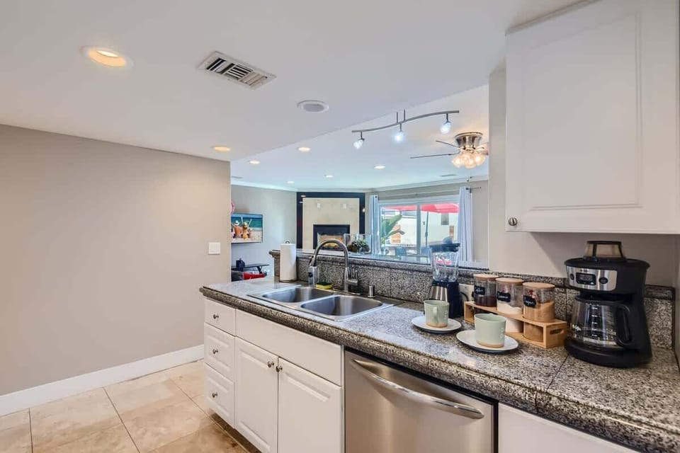 Enjoy the full kitchen with coffee, creamers, mixers, spices, refrigerator, oven, microwave, stove, pots, pans, cooking supplies, cutlery, cups, plates, bowls, utensils, small appliances, and many essentials!