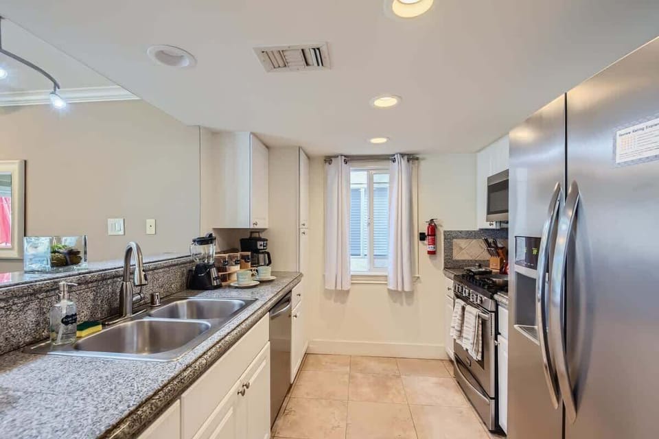 Enjoy the full kitchen with coffee, creamers, mixers, spices, refrigerator, oven, microwave, stove, pots, pans, cooking supplies, cutlery, cups, plates, bowls, utensils, small appliances, and many essentials!