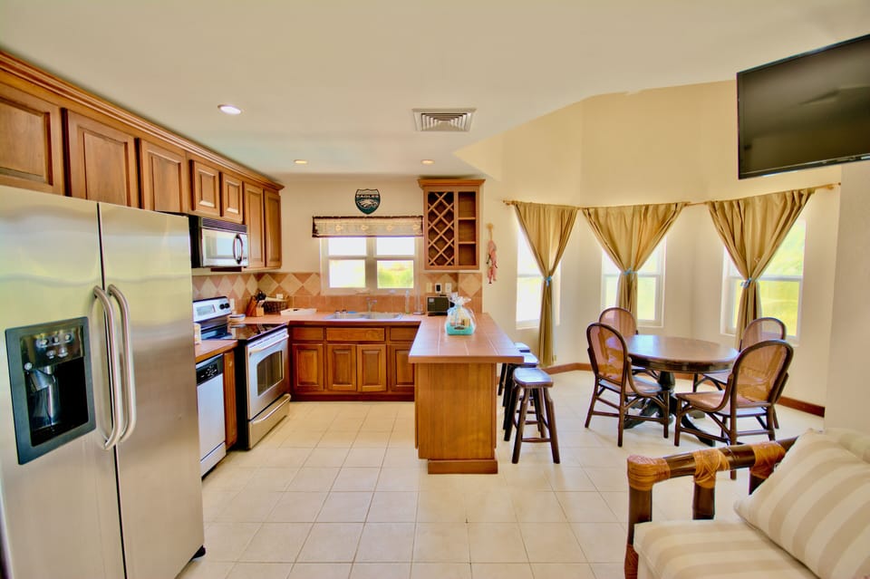 Kitchen & rounded dining alcove with bay windows