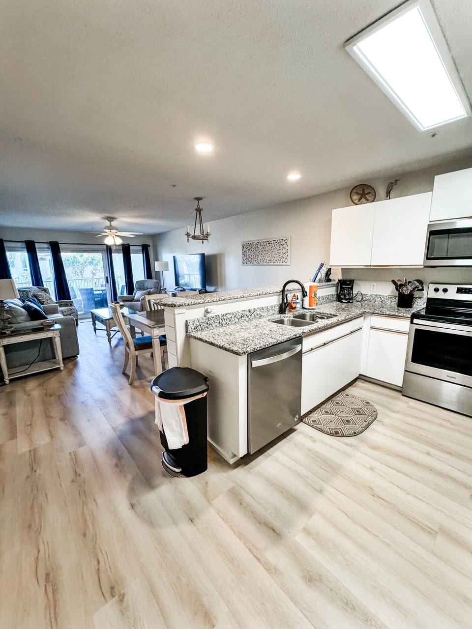 Our gorgeous kitchen features stainless steel appliances & brand new flooring.