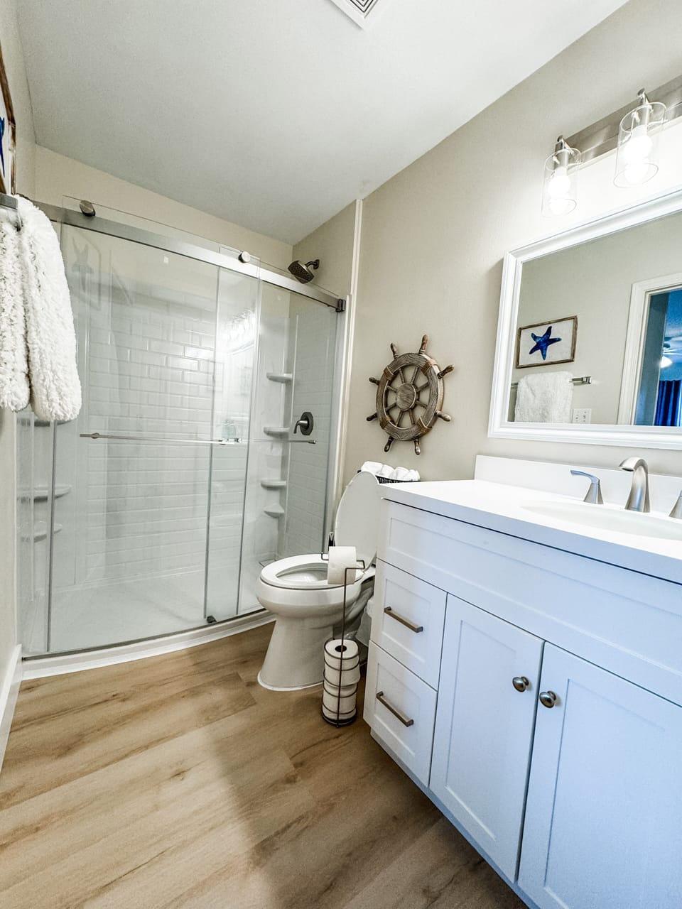 Primary bathroom is newly renovated with new shower, vanity, toilet & flooring!