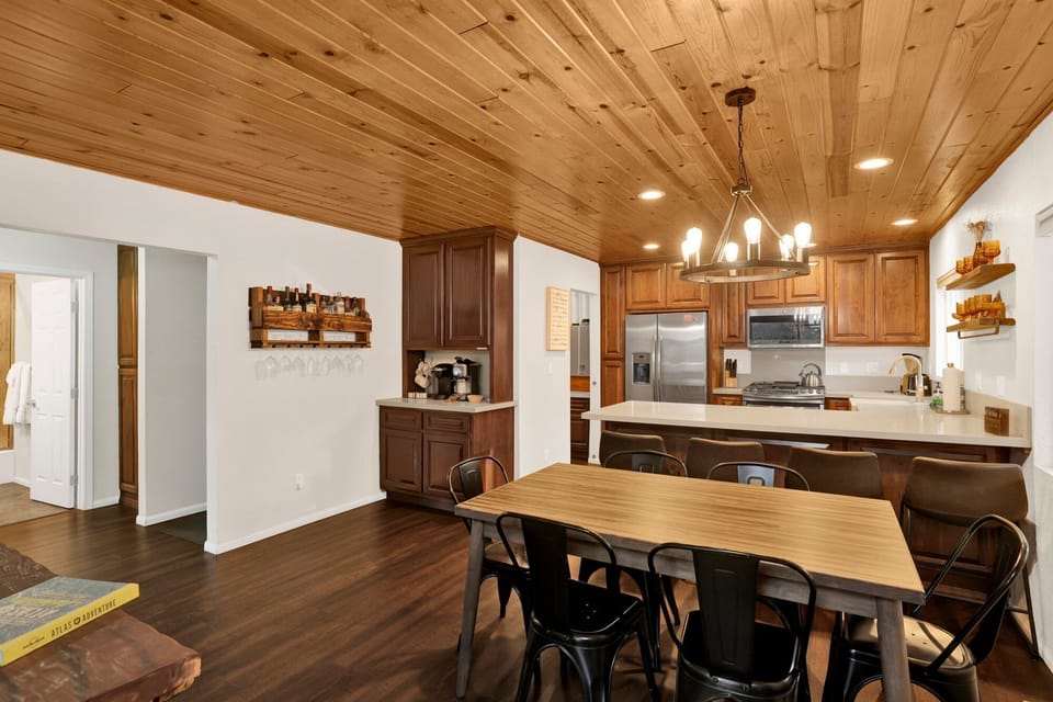 Fully equipped cabin kitchen with ample cabinetry, stove, fridge, microwave, and coffee maker—perfect for cooking meals, morning coffee, and feeling right at home on your stay.