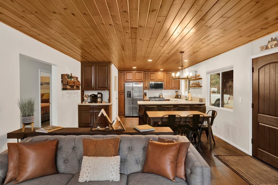 Fully equipped cabin kitchen with ample cabinetry, stove, fridge, microwave, and coffee maker—perfect for cooking meals, morning coffee, and feeling right at home on your stay.