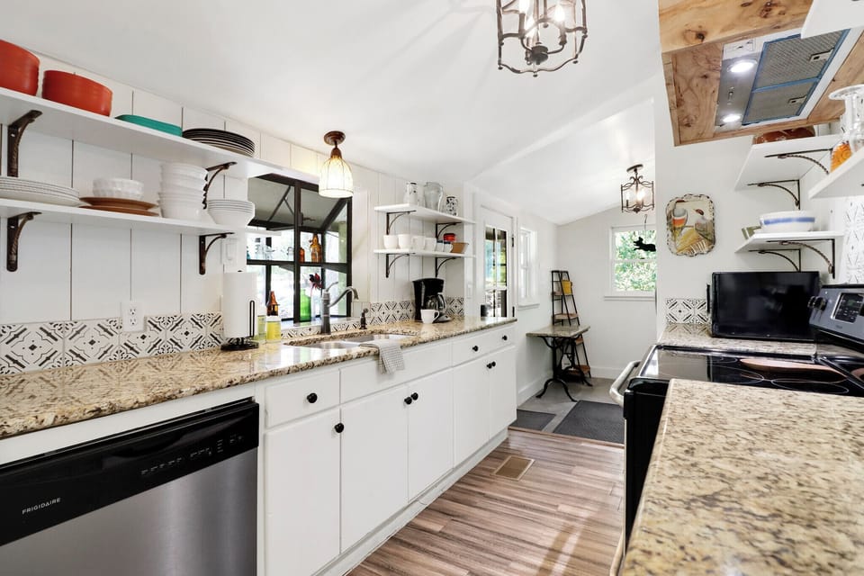 Your well-appointed kitchen features modern stainless-steel appliances ready for meal prep during your stay