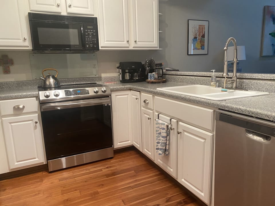 fully equipped kitchen with stainless steel appliances