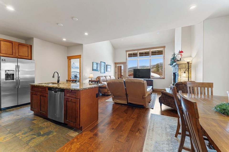 Gather with loved ones in your open-concept living space, where the gourmet kitchen flows seamlessly into cozy seating and dining areas.