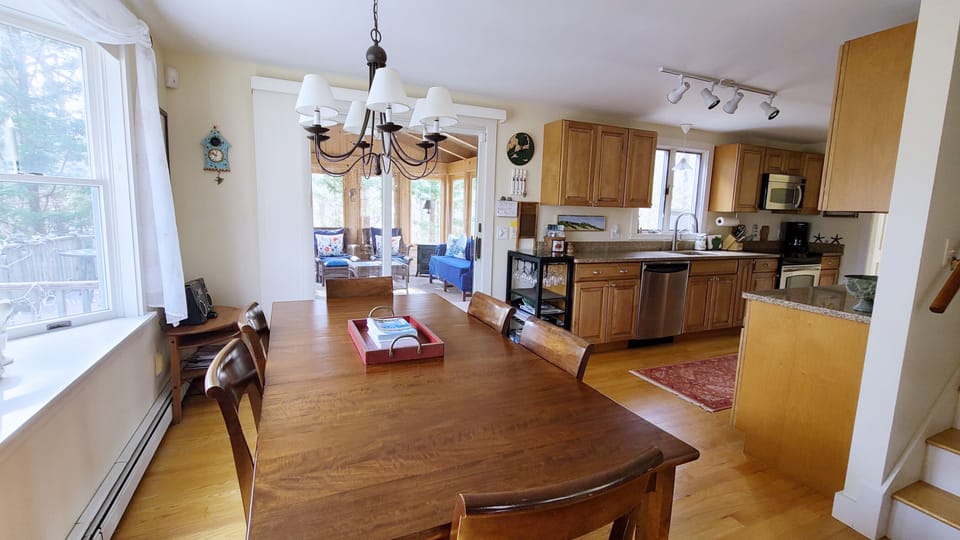 Dining area with slider to screen porch