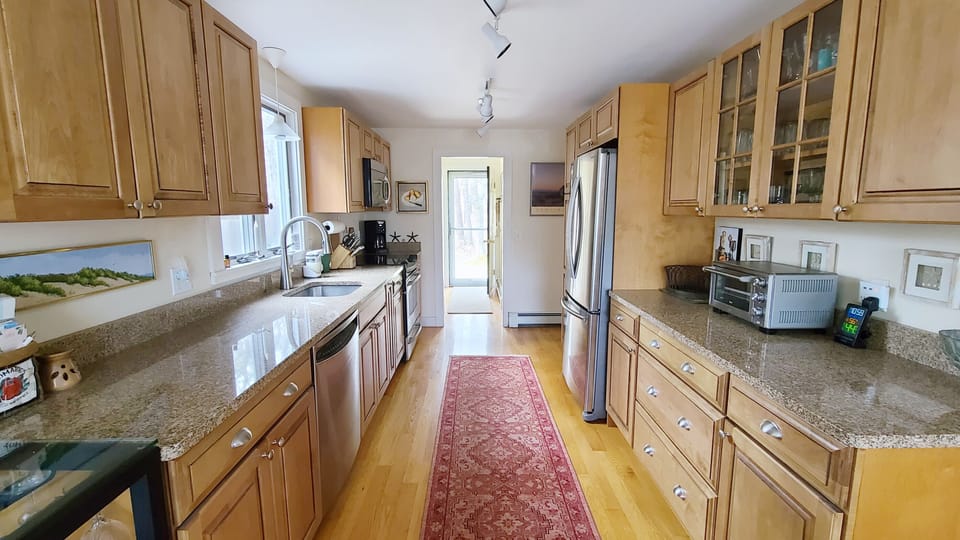Nicely equipped kitchen with stainless appliances