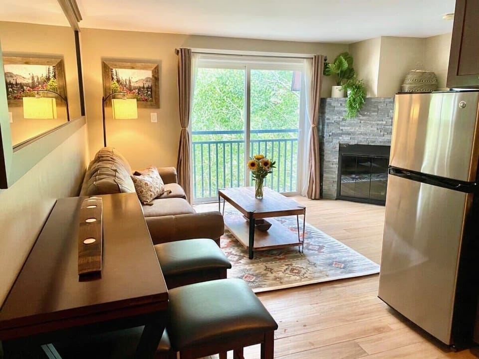 Family room with flat screen TV & balcony
