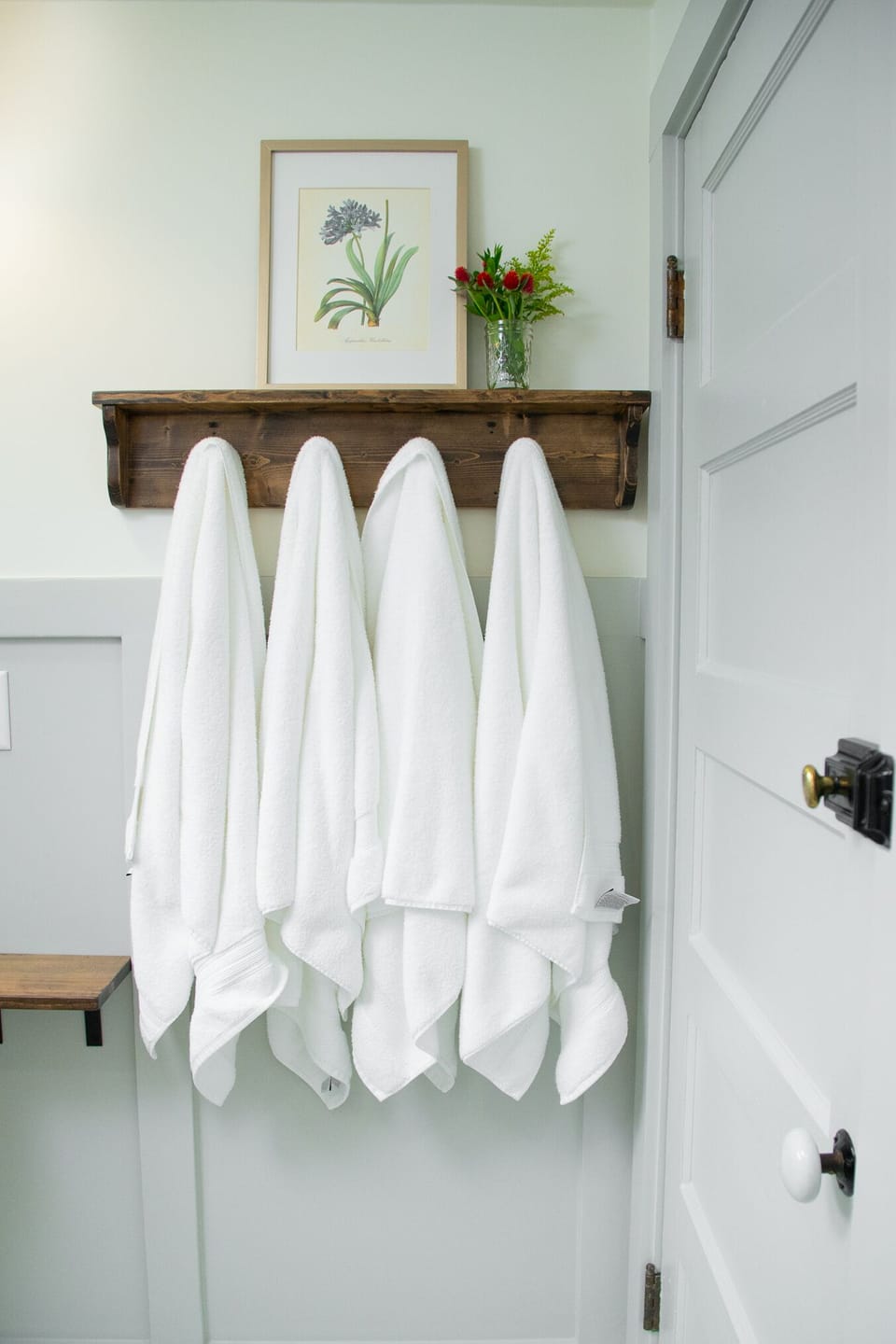 Fluffy bath towels & black makeup removal towels for a spa experience.