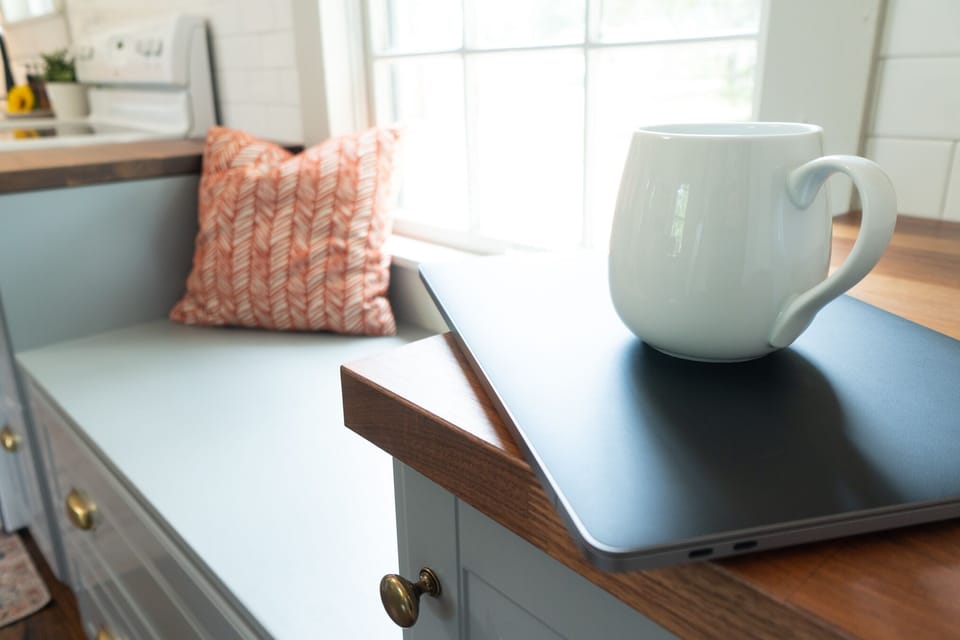 The window seat in the kitchen is a great place to cozy up with some hot coffee