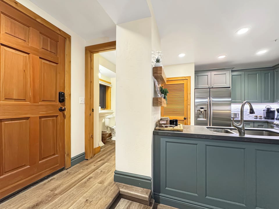 Right off the kitchen, you'll enjoy the convenience of a full bathroom and...