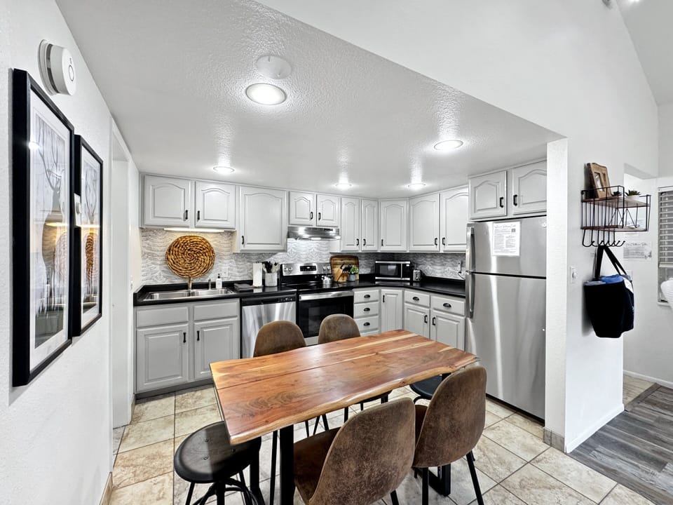 The kitchen has been thoughtfully updated with modern touches for both style and function.