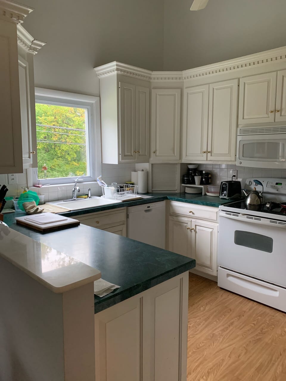 Kitchen with Keurig coffee maker, toaster and microwave for your use.
