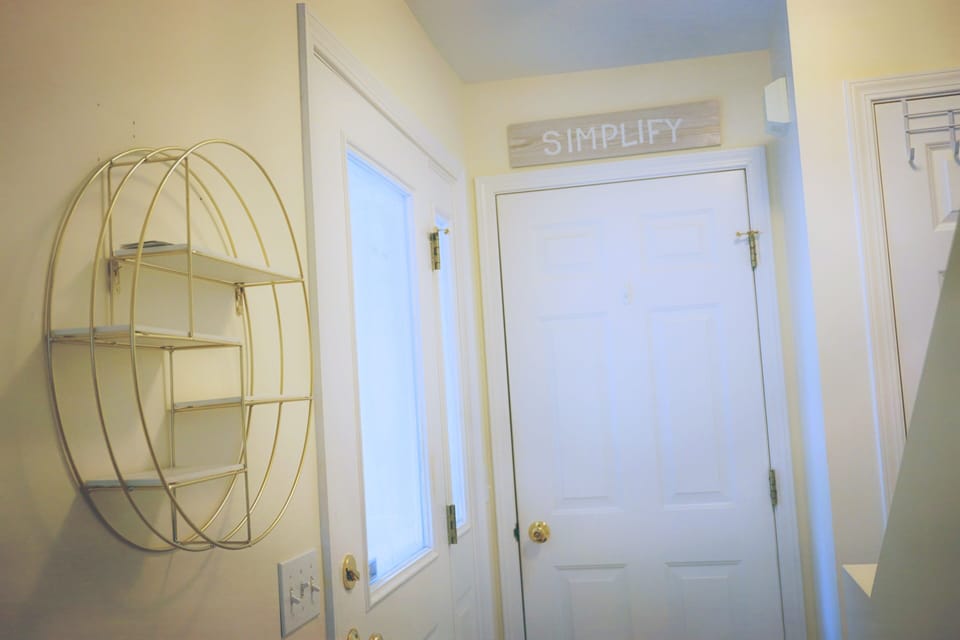 Entryway w/closet and garage door.