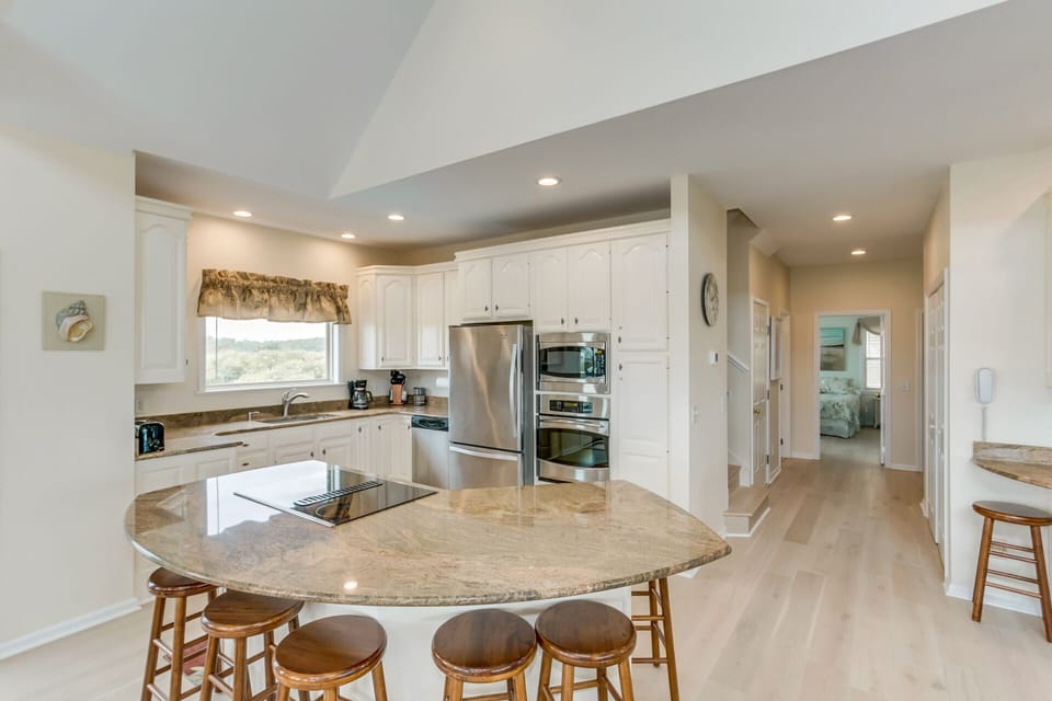 Well equipped kitchen with seating at island