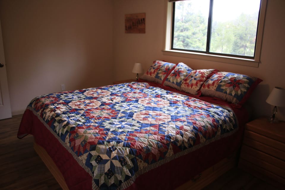 Upstairs master bedroom with California king bed.