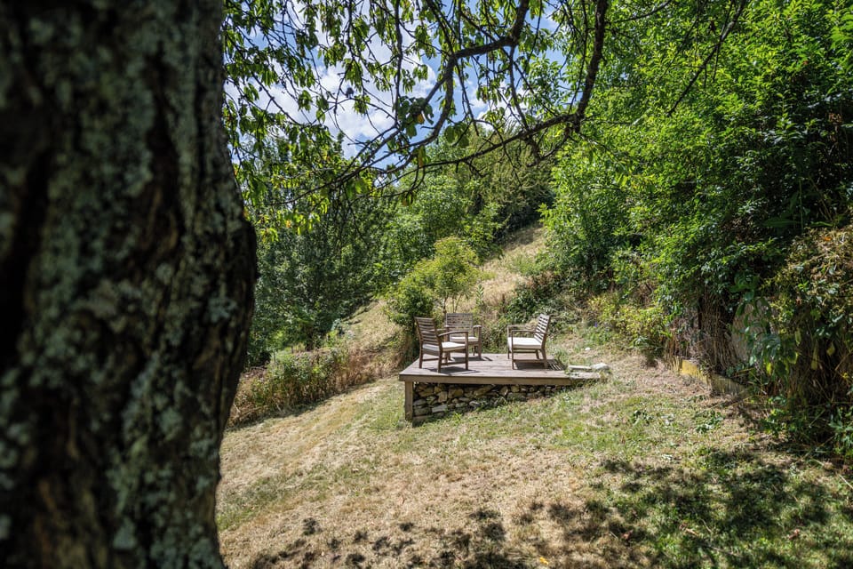 At the rear of a garden is a terrace where you can sit with views of the valley.