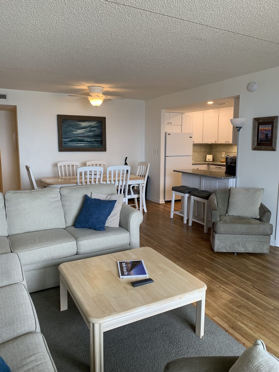 Looking from balcony to living/dining room and kitchen/breakfast bar.
