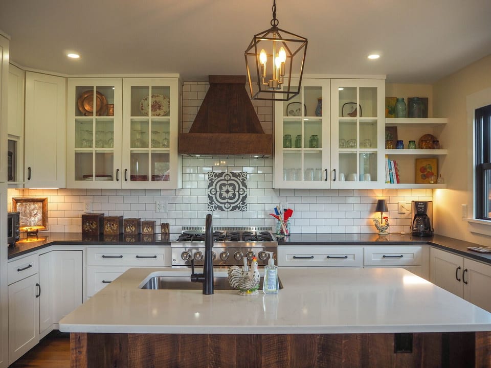 Kitchen stocked with dinnerware and amenities for 12 people