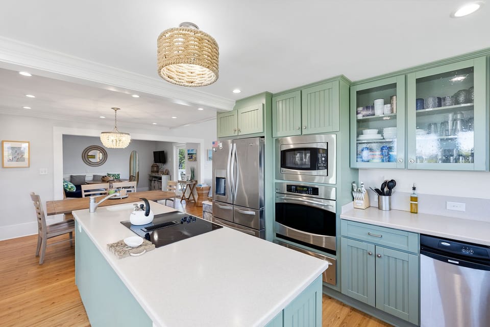 Modern kitchen with all amenities; open to living area & features ocean views