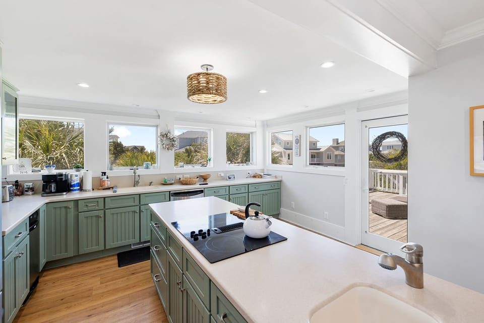 Modern kitchen just inside entry with ocean views