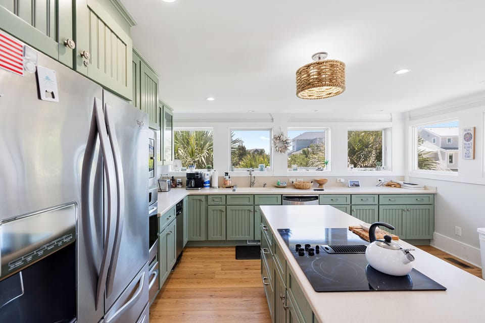 Modern kitchen with all amenities; open to living area & features ocean views
