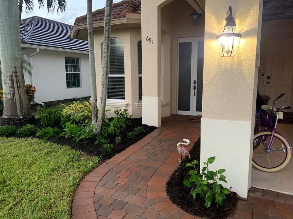 Paver sidewalk with newly install front plantings