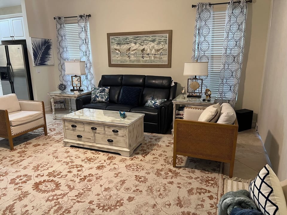 Living room with sofa with automatic recliners